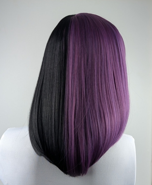 Nova - Lush Wigs UK Nova takes on the dramatic colour divide. Gothic mix of purple and black colours. Split down the centre parting and carrying the colour through the sleek fringe. Styled into a straight one length bob that curls gently at the ends.