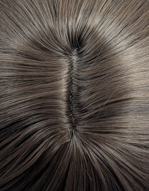 Poppy - Lush Wigs UK This jaw-skimming bob, styled with a gentle flick curl at the ends. Short choppy layers add volume. With a sleek light fringe. A colour mix of warm light browns from roots to tips. Easy to wear and maintain.