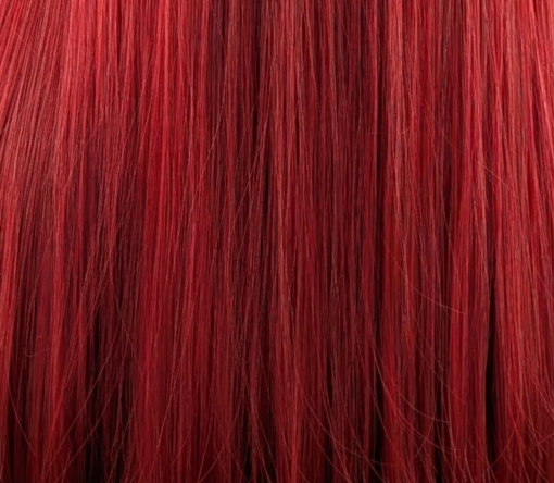 A rich, jewel toned ruby red from the roots to tips. The cut is long with invisible layers and dead straight with a full blunt fringe. 