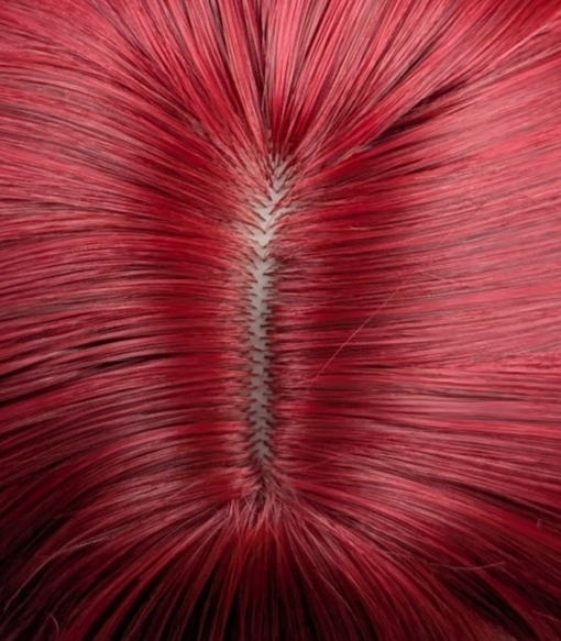A rich, jewel toned ruby red from the roots to tips. The cut is long with invisible layers and dead straight with a full blunt fringe. 