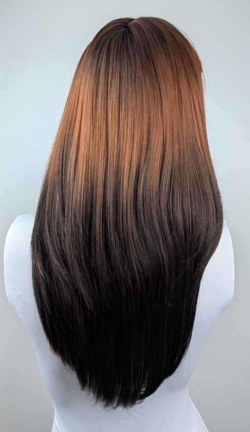 Rosaleen - Lush Wigs UK This natural wig with dark brown roots blend into this copper ginger hue with dark brown ends. A sleek medium length style with long layers at the back. Face framing layers at the front make this style easy to maintain. A blunt sleek fringe frames the face.