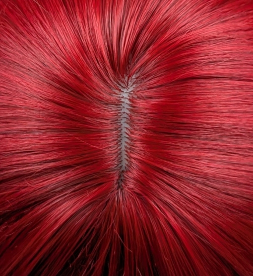 This sleek style comes in a vivid fire engine red colour from roots to tips. Cut into long layers that fall to the waist. Finished in a barrel brush blow out, with a sleek blunt fringe.