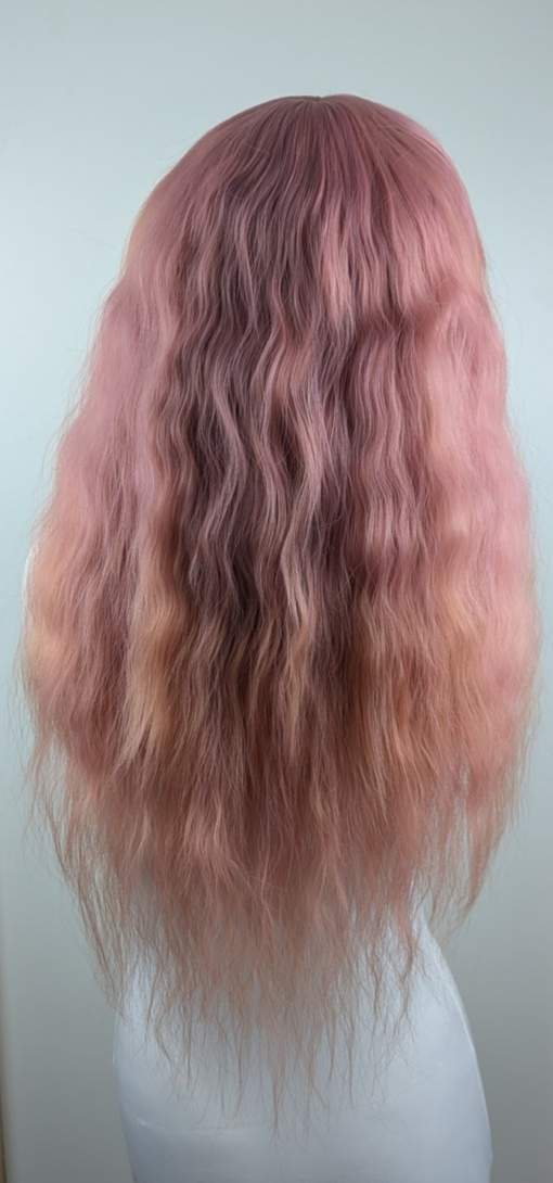 This wig is so fluffy. A soft crimped mermaid waves style in a blend of coral pink that fades into a warm-toned peach. The sleek long fringe is versatile to be worn to suit your look.
