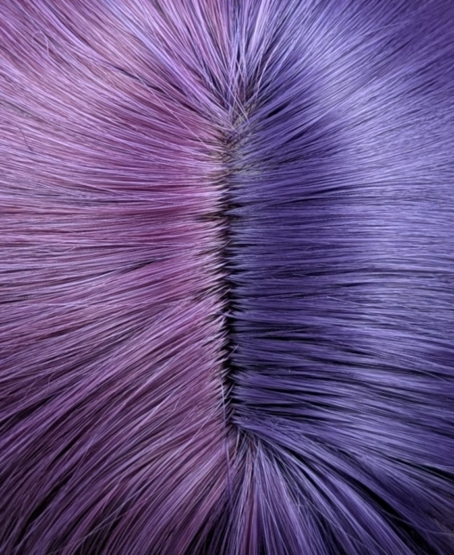 Verbena - Lush Wigs UK This two tone split colour wig has one half violet and on the other side a muted purple. The sleek blunt fringe carries the colours seamlessly. Styled into loose barrel curls with plenty of volume.