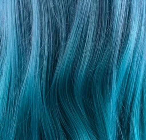 Shades of blue fade into a turquoise colour at the ends. Subtle waves and layers add shape and body. A long sleek fringe can be styled to suit you - however you want to wear it.