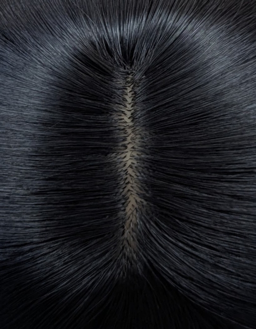Winter - Lush Wigs UK Winter is a natural warm black colour from roots to tips. A barely there wave running through the lengths. With invisible layers cut in for movement and shape. A blunt sleek fringe completes the look.