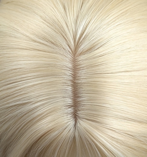 Zeus - Lush Wigs UK This multi-colour wig is a mixture of purple, blues, limes, greens and peach. From the nape of the neck giving a peek-a-boo effect. A natural blonde colour from the roots, thats carried into the sleek blunt fringe. Long and curly with invisible layers for bounce and volume.