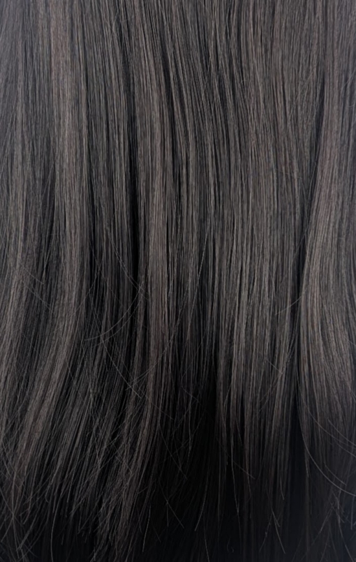 Dark Chocolate - Lush Wigs UK This natural wig is a mix of warm dark brown almost black colour. Styled sleek with long layers at the front. A full blunt fringe gives a full volume look to this medium-long layered style.