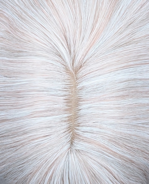 Songbird - Lush Wigs UK This creamy white wig has a hint of subtle pink from roots to tips. Styled into loose barrel curls. With a sleek blunt fringe.