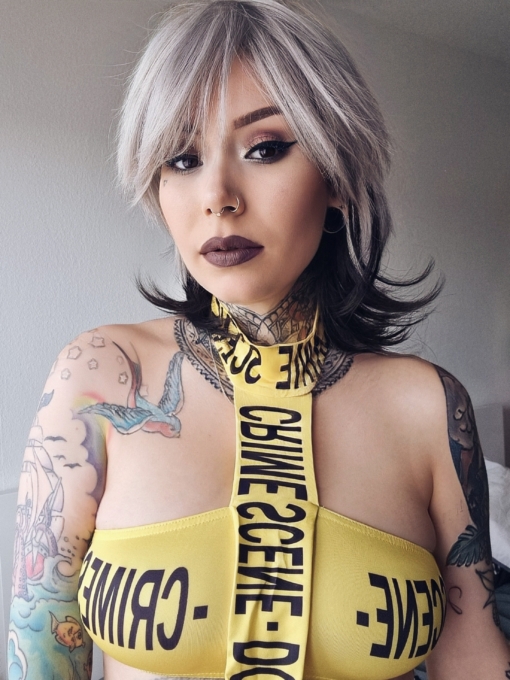 Liquorice - Lush Wigs UK This shaggy short layered sleek cut has body at the crown with a full fringe in a natural grey tone. At the back of the head a layer in a dark brown tine with subtle flick to the ends.