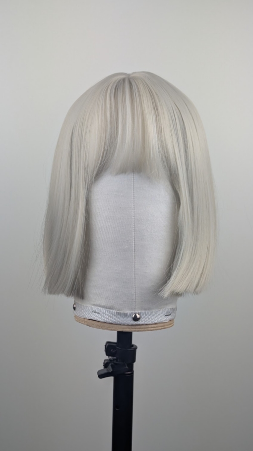 Outlet #270 - Lush Wigs UK A classic one length bob in a diamond blonde colour from roots to tips. Cut into a sleek blunt on length style with light fringe.