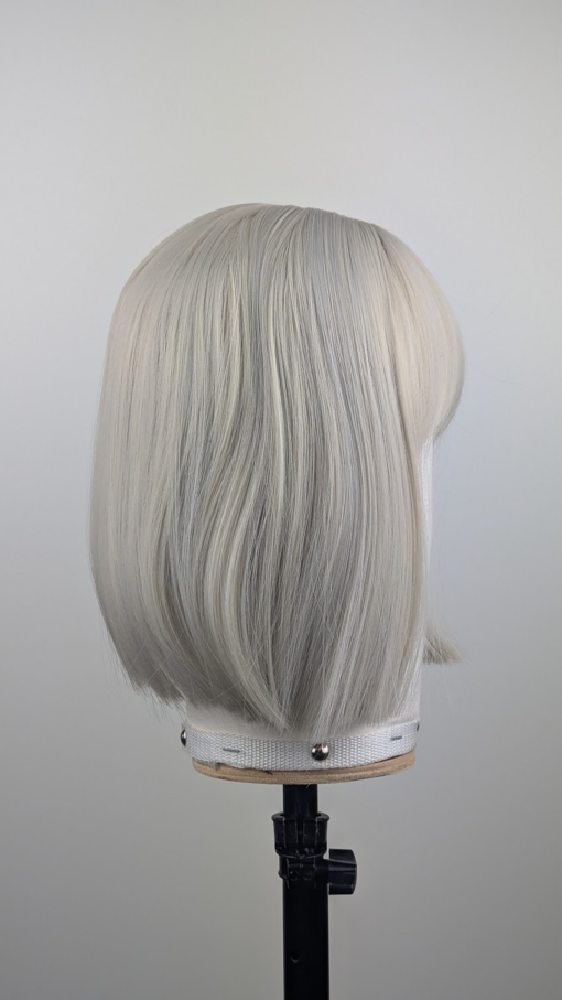 Outlet #270 - Lush Wigs UK A classic one length bob in a diamond blonde colour from roots to tips. Cut into a sleek blunt on length style with light fringe.