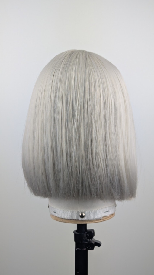 Outlet #270 - Lush Wigs UK A classic one length bob in a diamond blonde colour from roots to tips. Cut into a sleek blunt on length style with light fringe.